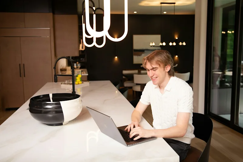 Relieved founder smiling laptop   