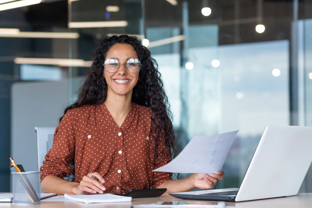 smiling professional woman at laptop