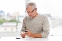 man with diabetes testing his blood glucose levels