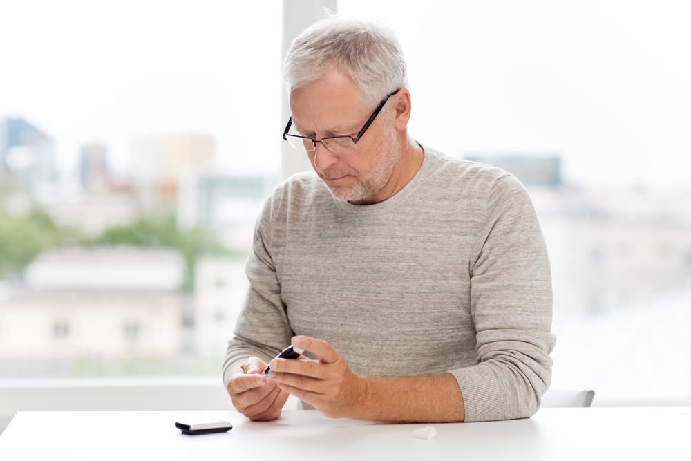 Man monitoring his blood sugars