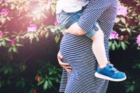 pregnant woman with child - complications of gestational diabetes can affect both mother and child