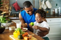 Father and son cooking together - a healthy diet can help to prevent prediabetes