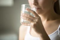 woman drinking water - excessive thirst may be a symptom of type 1 diabetes