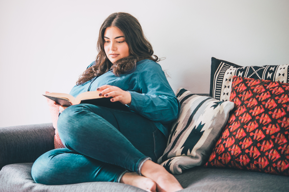 woman with diabetes reading a book prioritising herself