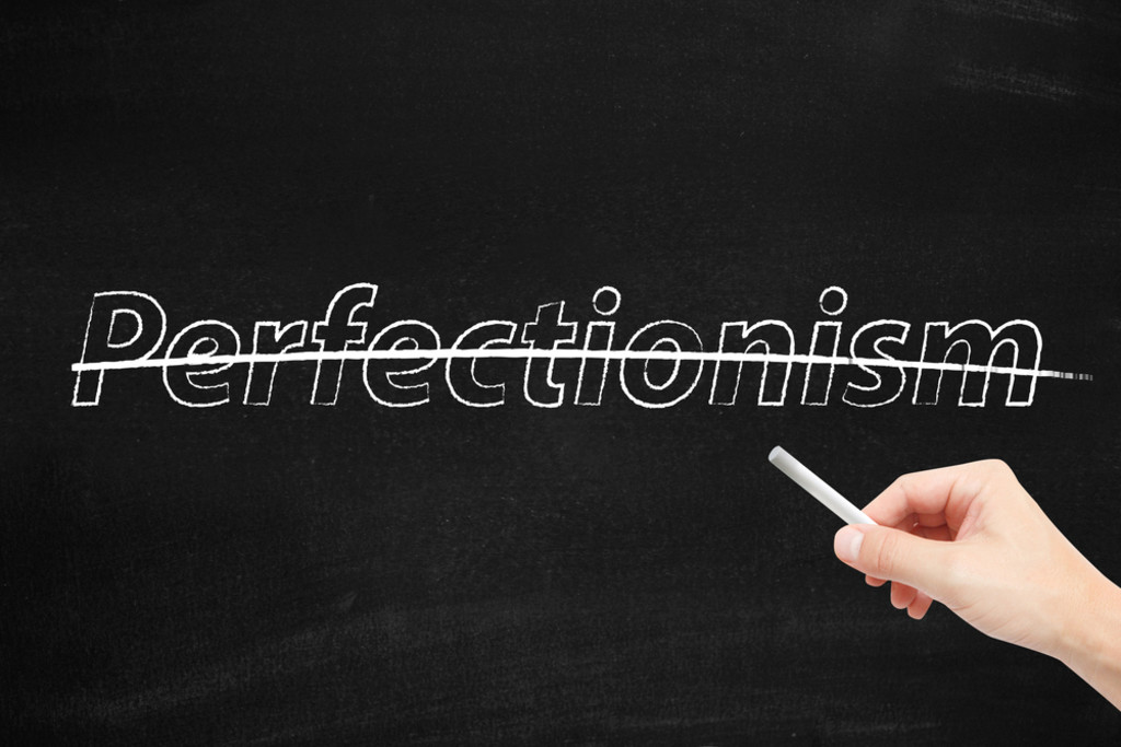 Perfectionism written on wall