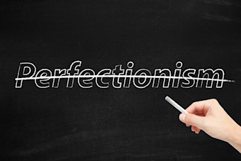 Perfectionism written on wall