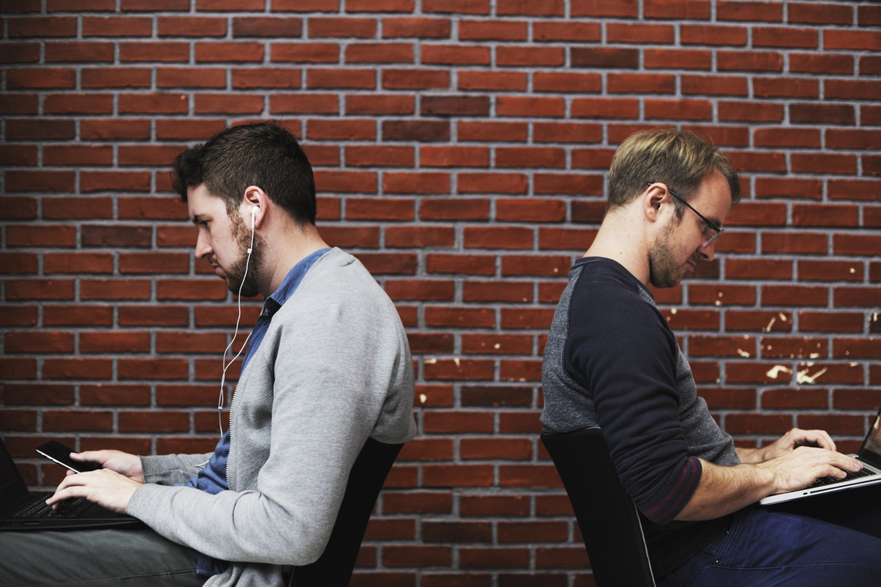 men sitting for a long time