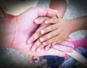 father holding the hands of his kids who have diabetes