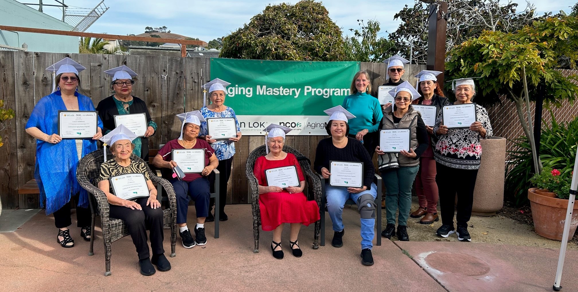 Seniors posing with their certificates after taking the AMP course.