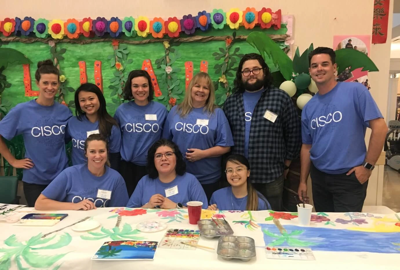 Cisco Volunteers gather for a portrait after an art seminar for Seniors at OnLok