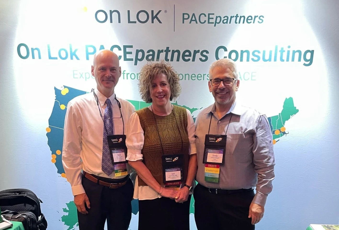 PACEpartners team at the National PACE Association conference in 2023 standing in front of their booth.