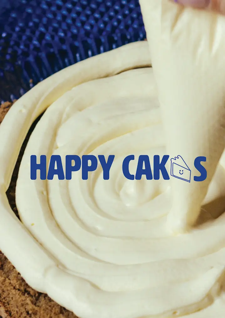 The Picture Shows A Close Up Of Someone Applying A Smooth, Creamy Frosting In Circular Motions On Top Of A Cake Using A Piping Bag. The Frosting Appears Rich And Thick, Creating A Visually Appealing Texture That Emphasizes The Craftsmanship Involved In The Cake Making Process. In The Center Of The Image, The Brand Name "HAPPY CAKES" Is Prominently Displayed In Bold, Blue Uppercase Letters. The Font Is Playful Yet Clear, Reflecting A Joyful And Friendly Brand Identity. The Letter "E" In "CAKES" Is Stylized As A Slice Of Cake With A Smiley Face, Reinforcing The Cheerful And Approachable Nature Of The Brand. This Small Icon Adds A Whimsical Touch, Making The Brand Feel Warm And Inviting. The Overall Color Scheme Is Primarily Focused On The Natural Tones Of The Frosting And Cake, With The Blue Text Standing Out Vividly Against The Background, Making The Brand Name Easy To Read And Memorable. The Image Captures The Essence Of The Brand, Suggesting That "Happy Cakes" Is All About Creating Delicious, Joy Filled Experiences Through Their Baked Goods.