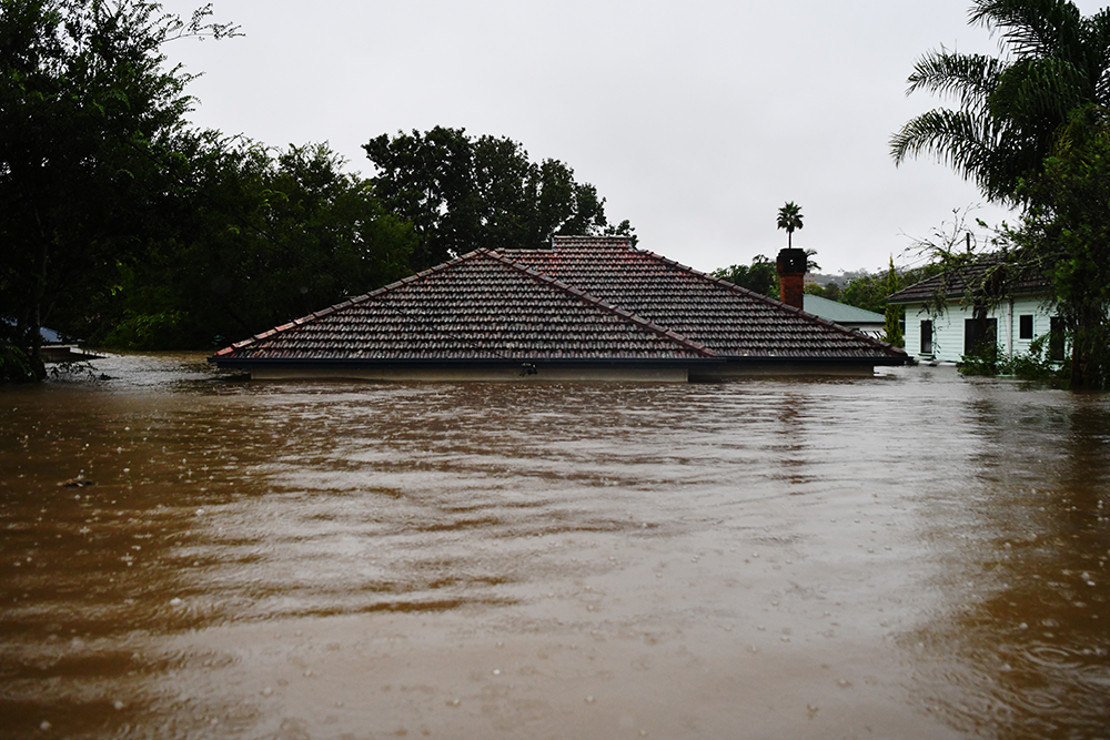 A house in Lismore CBD submerged underwater. 