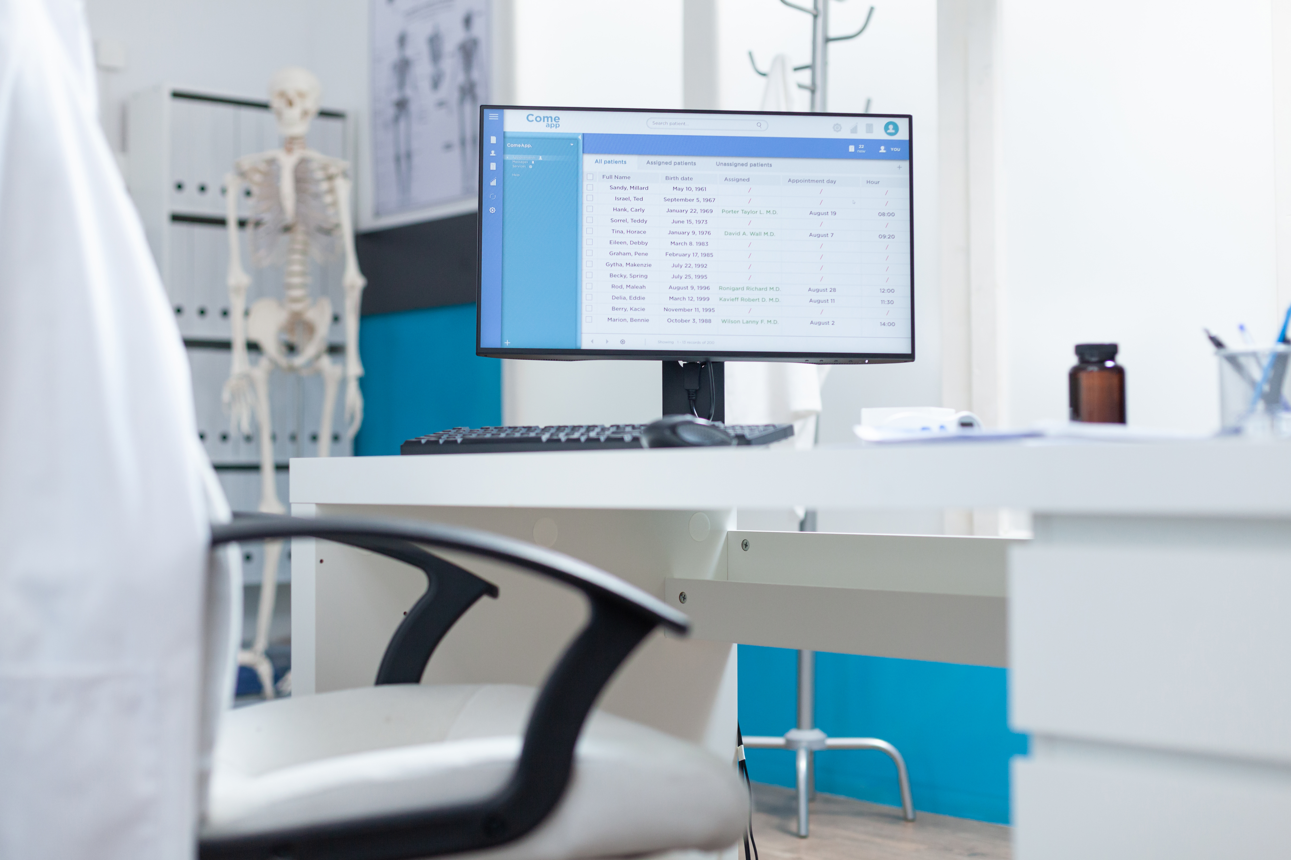 computer-with-medical-patient-files-screen-standing-table-empty-doctors-office-medical-examination-hospital-office-equipped-with-professional-modern-furniture-health-care-support