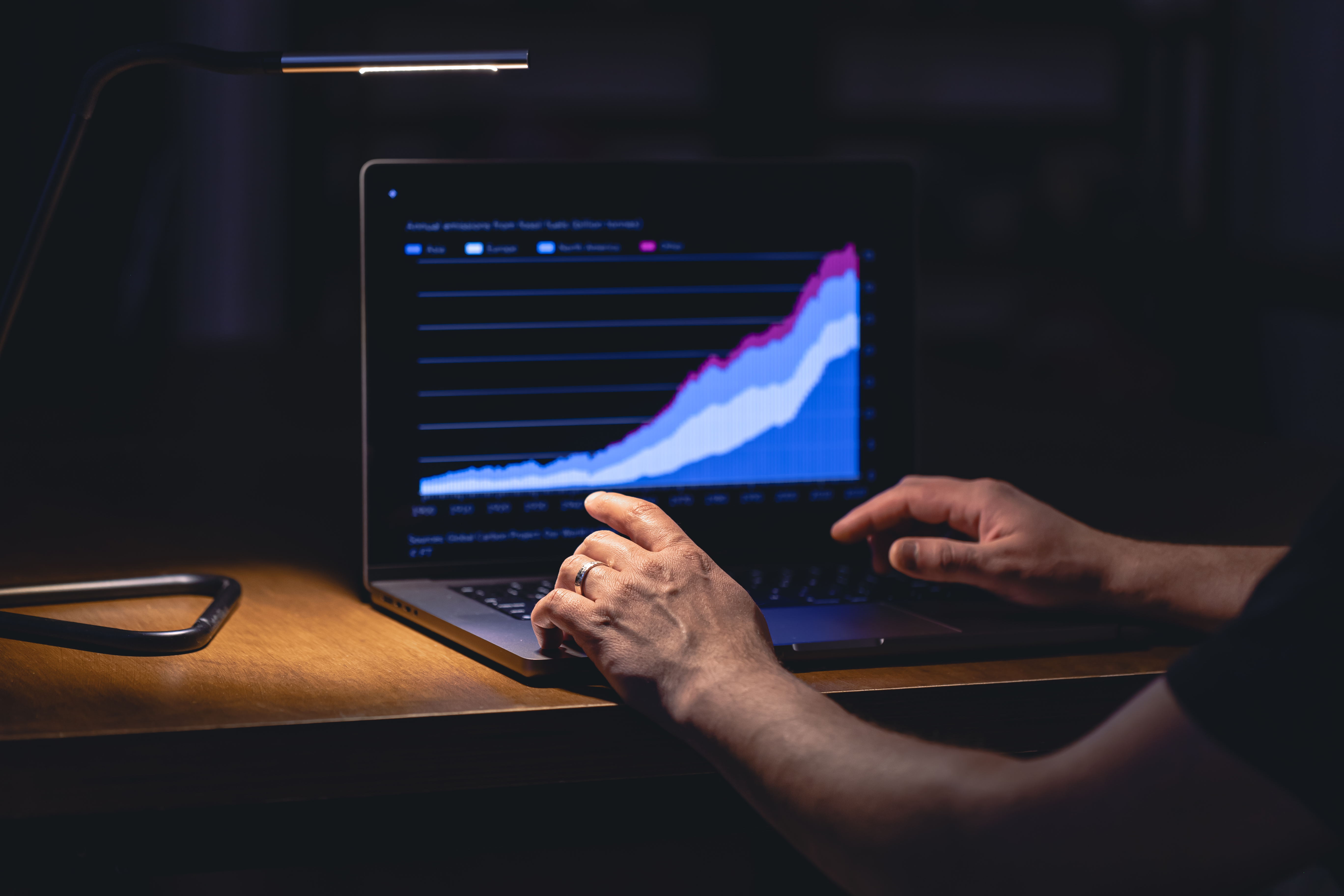 business-man-stock-exchange-trader-looking-laptop-screen-night