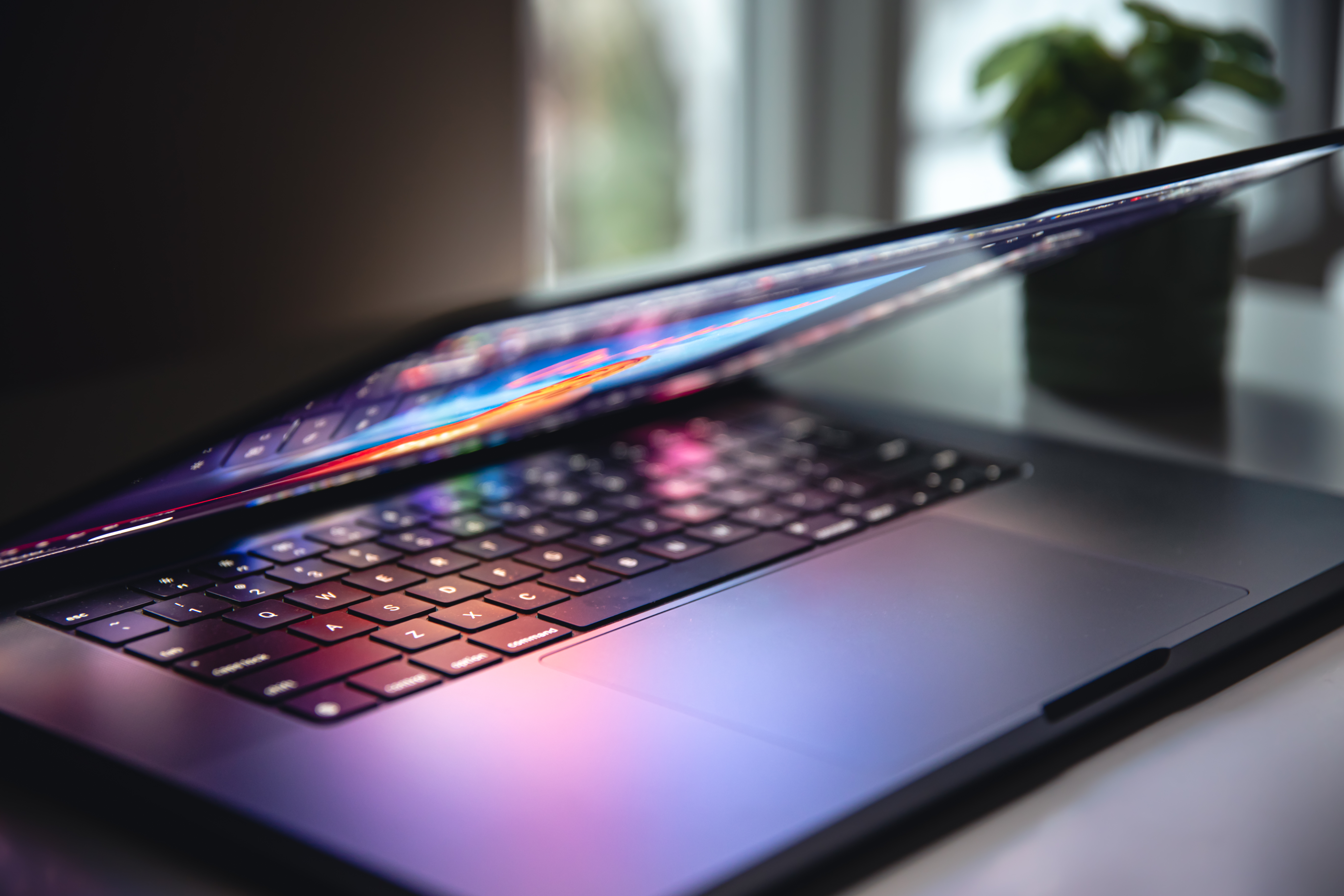 close-up-laptop-keyboard-colorful-neon-illumination-backlit-keyboard