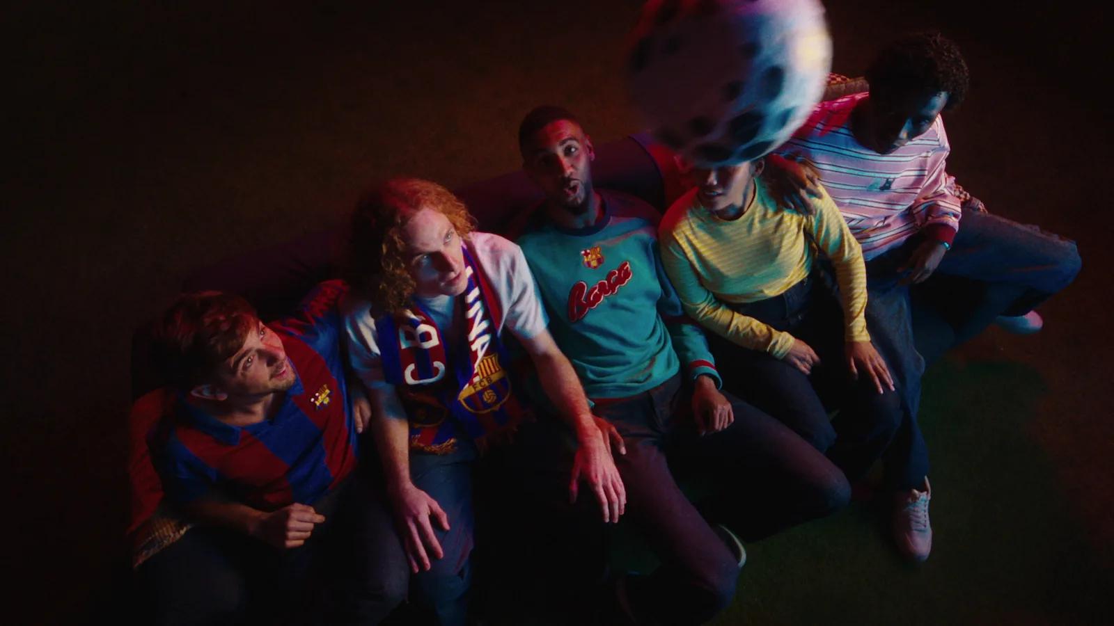 Fans with ball flying over Ambilight TV