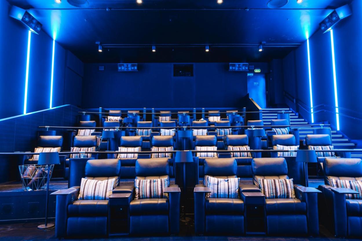 The cinema is equipped with luxurious leather recliners.