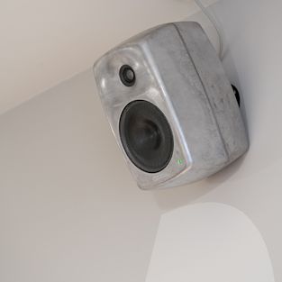 RAW AV Genelec mounted to a wall