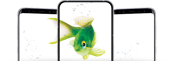 Three smartphones arranged side by side displaying screens, with a large green fish with a yellow eye appearing to swim across or through the phone displays.