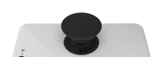 Prise PopGrip de PopSockets de couleur noire sur un appareil blanc.