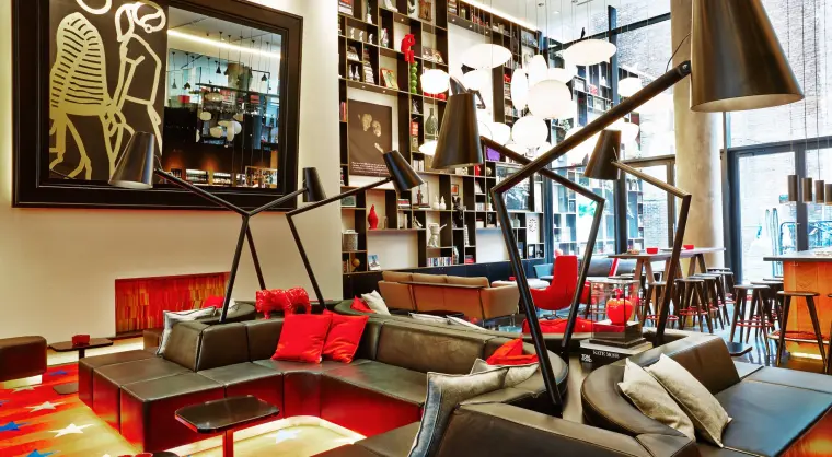 hotel living room in New York Times Square with art and Vitra furniture