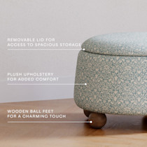 Removable lid and plush upholstery with wooden ball feet labeled