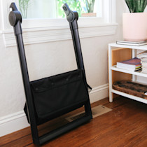 Stone blue bassinet stand folded view with storage basket extended