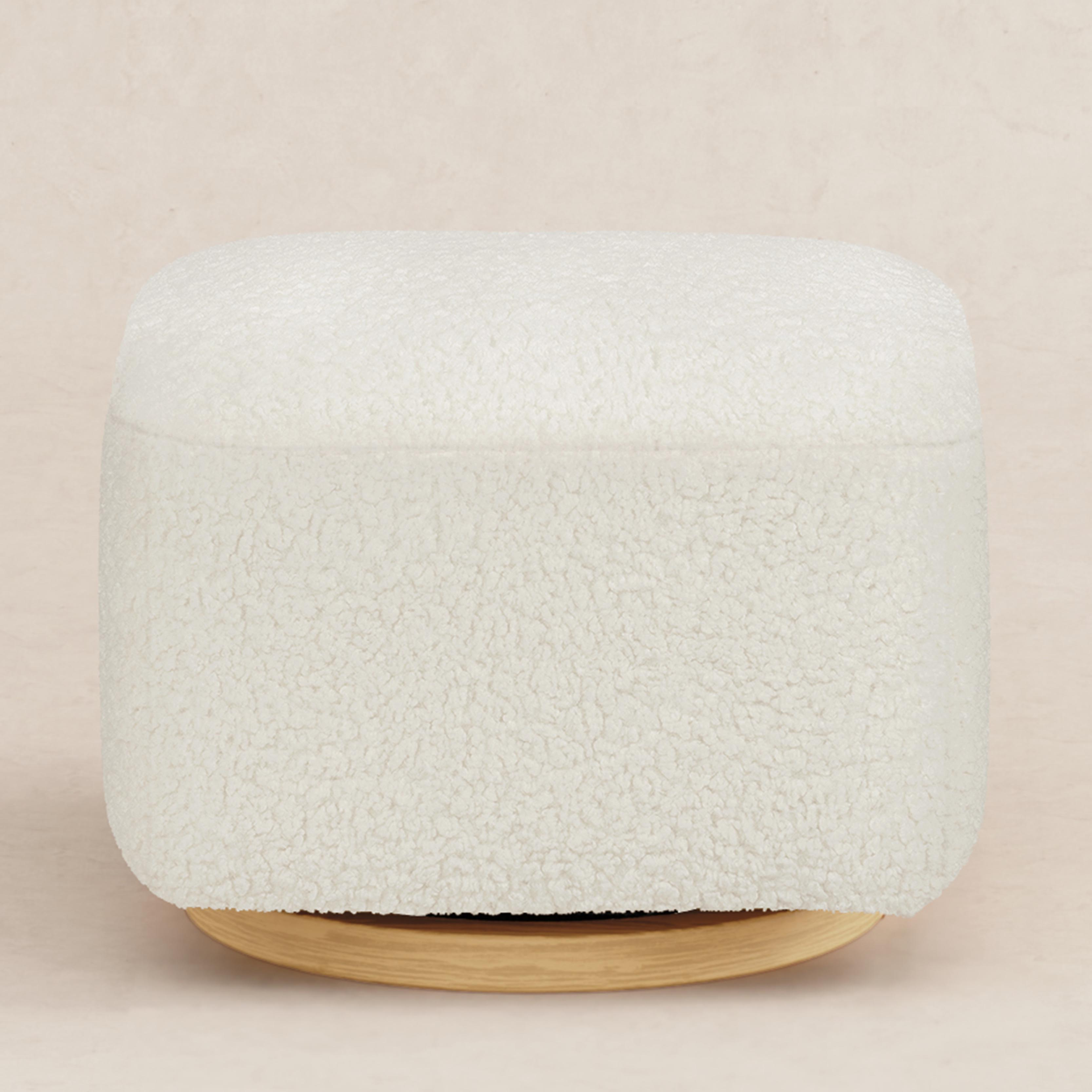 babyletto Kiwi Gliding Ottoman - Cream Shearling With Light Wood Base.