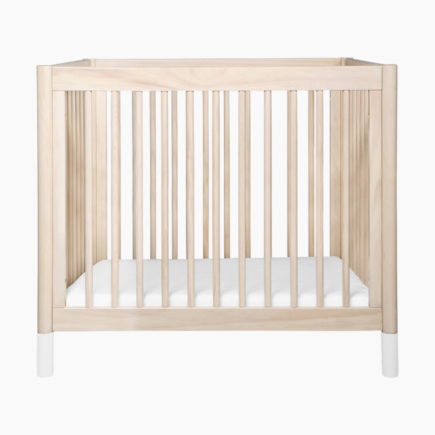 babyletto Gelato 4-in-1 Convertible Mini Crib - Washed Natural Finish With White Feet.
