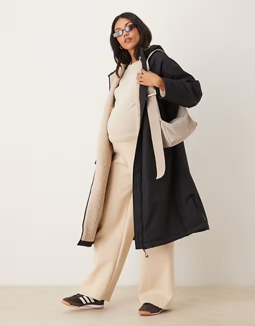 Longline Fleece Lined Rain Coat in Black.