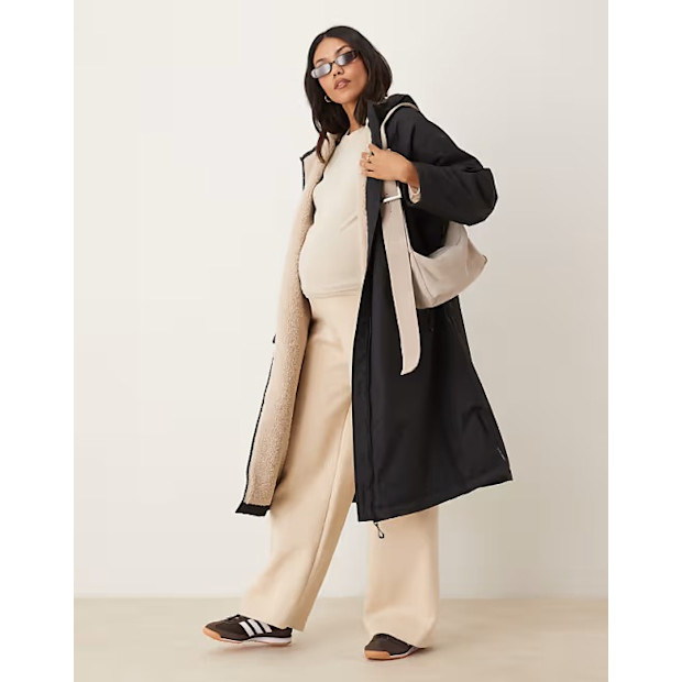 Longline Fleece Lined Rain Coat in Black.