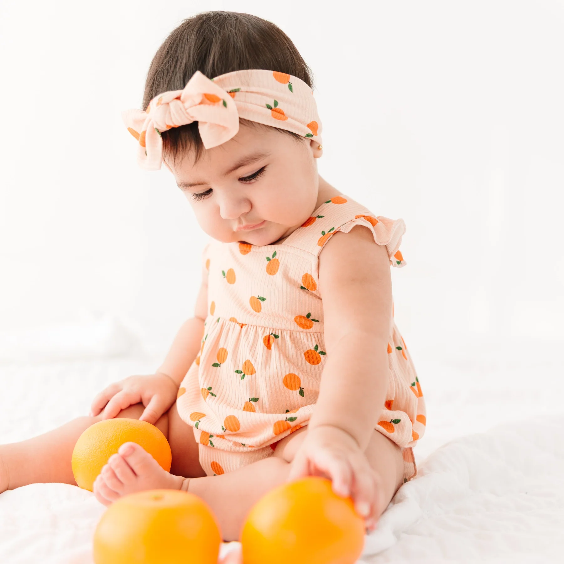 Brave Little Ones Oranges Small Ribbed Flutter Sleeve Romper.
