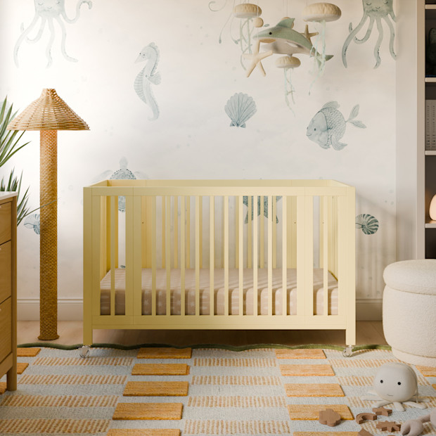 babyletto Rolli 9-in-1 Convertible All-Stages Crib with Bassinet & Toddler Bed Conversion Kits - Pale Yellow.