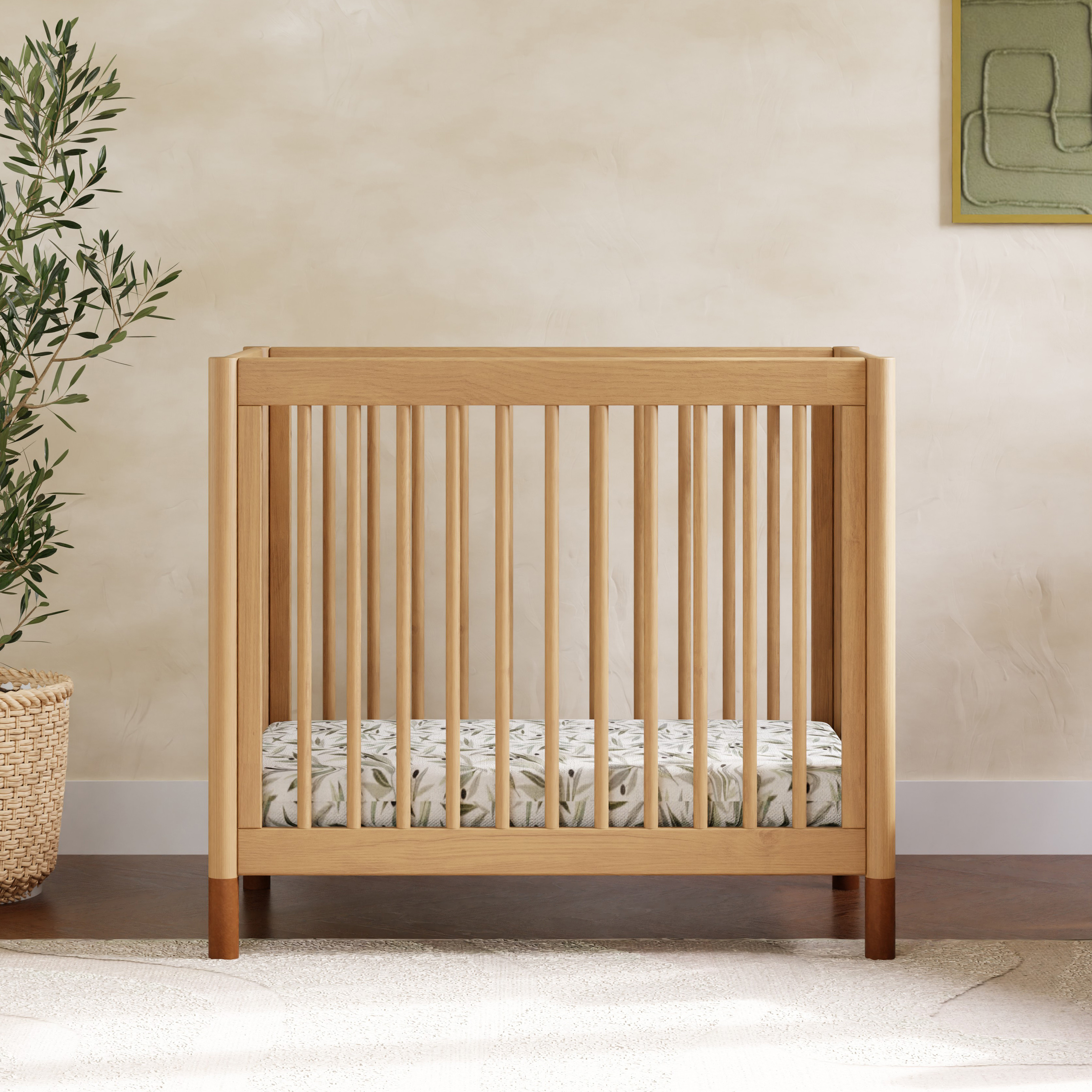 babyletto Gelato 4-in-1 Convertible Mini Crib - Honey With Vegan Tan Leather Feet.
