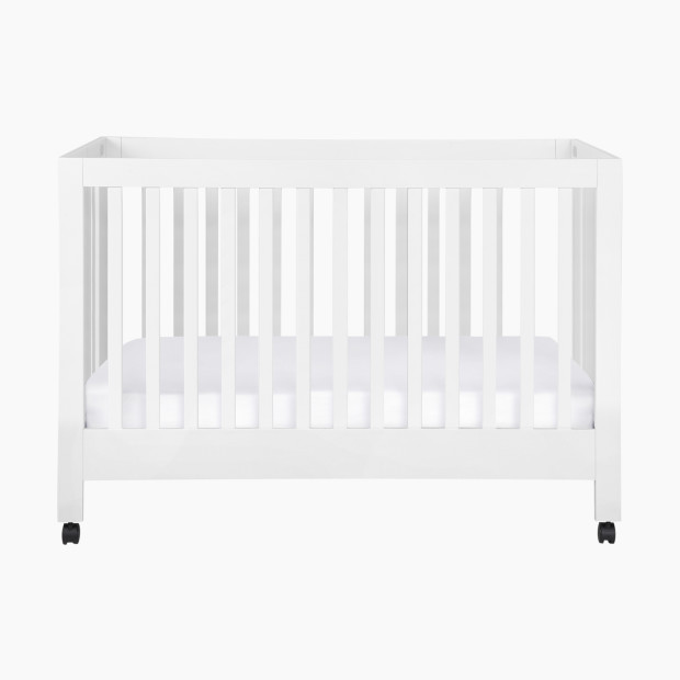 babyletto Maki Portable Folding Crib with Toddler Bed Conversion Kit - White.