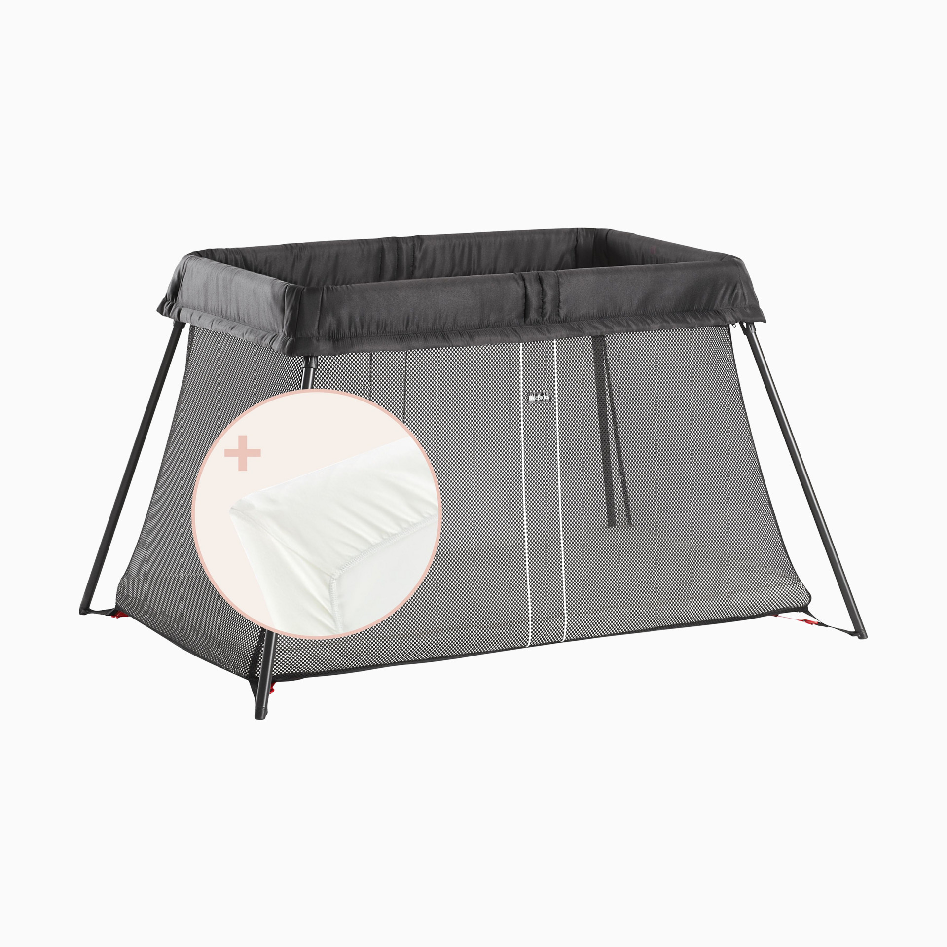 Black travel crib with mesh side and fabric cover on a plain background.
