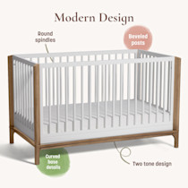 Modern design features labeled around crib including round spindles beveled posts and curved base