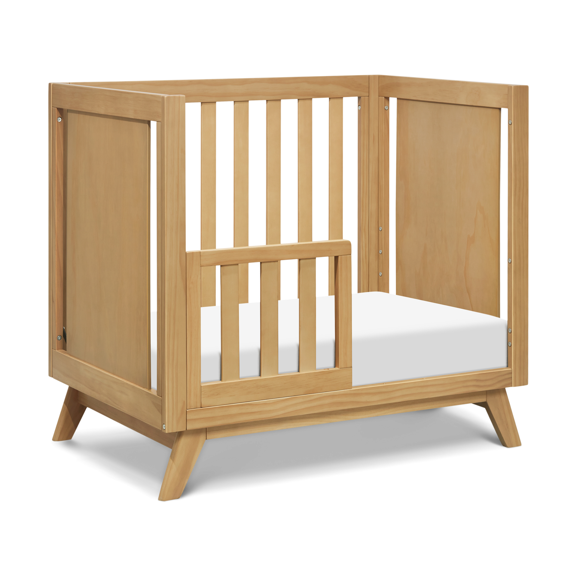 daVinci Otto 3-in-1 Convertible Mini Crib with 4" Mattress - Honey.