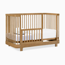 Crib with guardrail and mattress