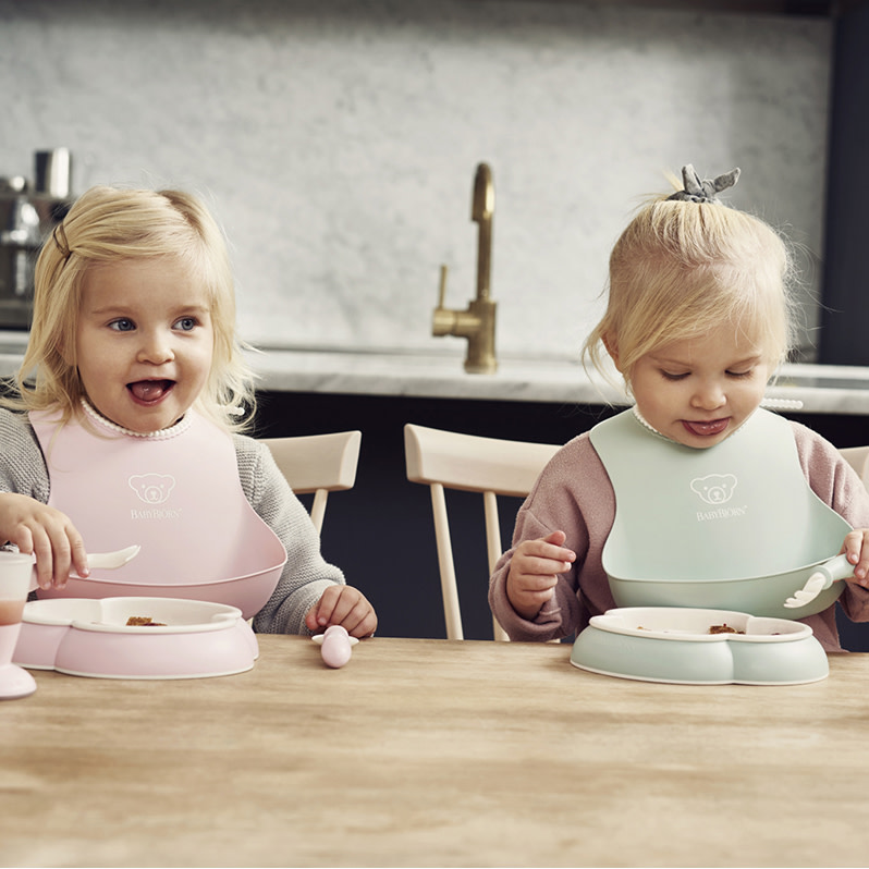 BabyBjörn Baby Bib (2 Pack) - Powder Green/Powder Pink.