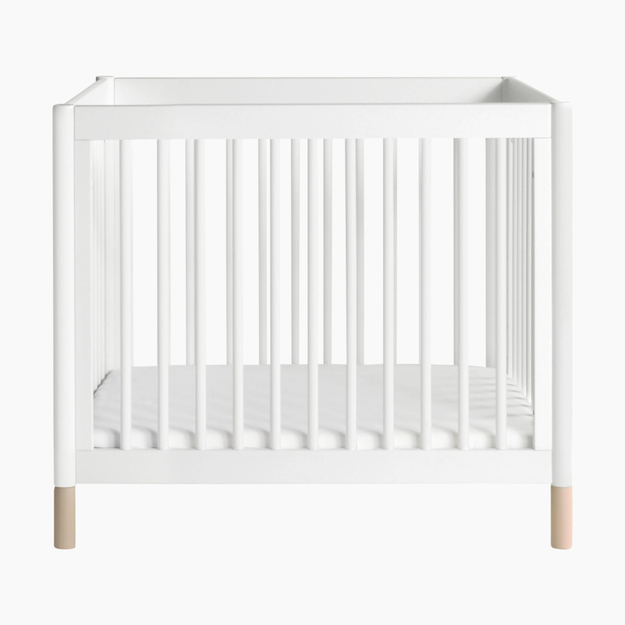 babyletto Gelato 4-in-1 Convertible Mini Crib - White Finish With Washed Natural Feet.