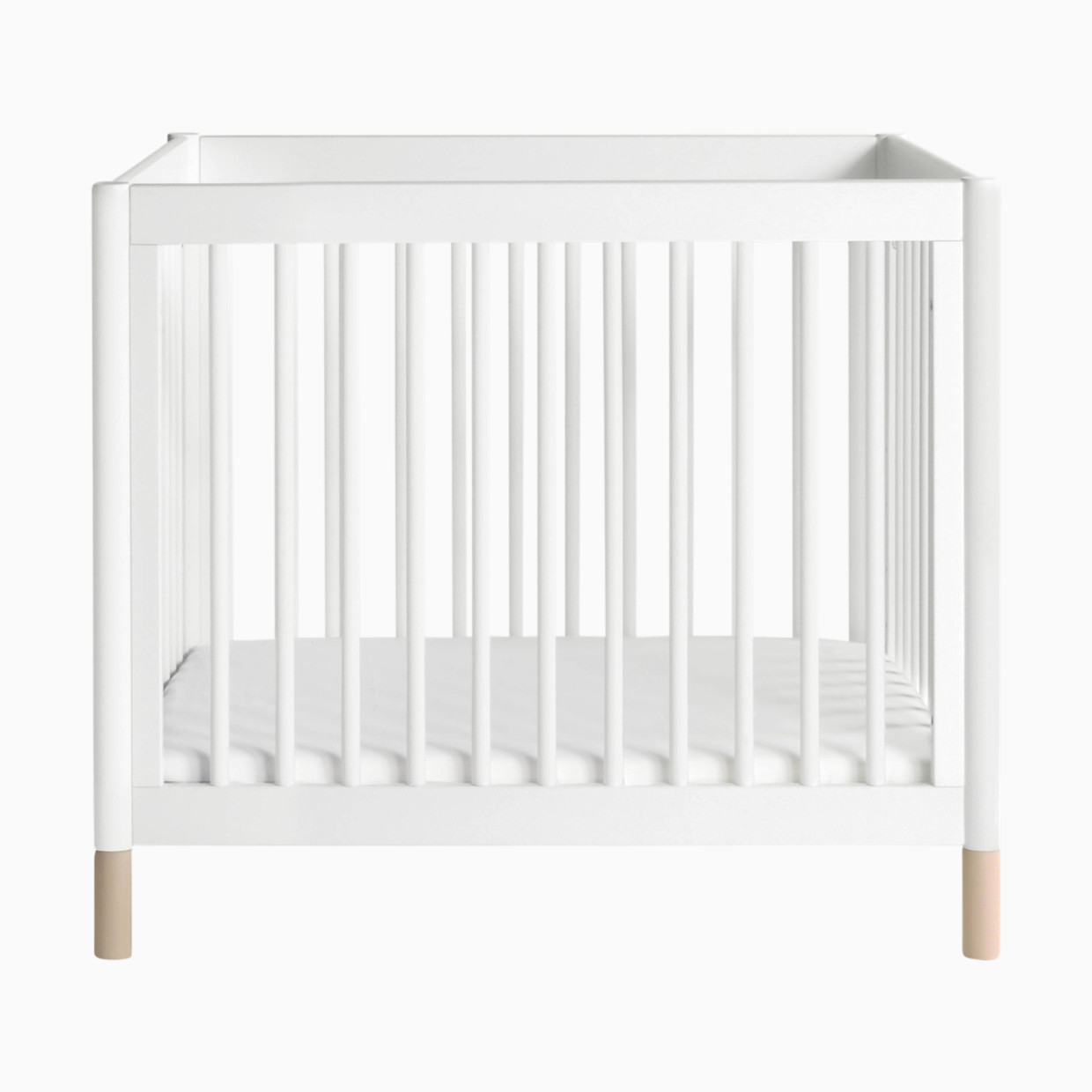 babyletto Gelato 4-in-1 Convertible Mini Crib - White Finish With Washed Natural Feet.