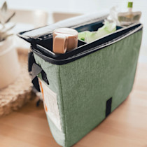 Green storage bag with zipper and interior items