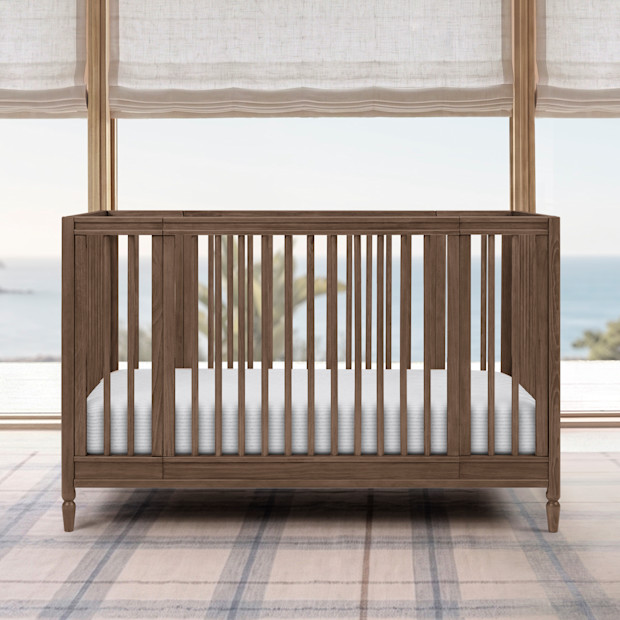 Delta Children Jalen Grow With Me 9-in-1 Convertible Bassinet to Crib.