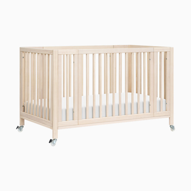 babyletto Rolli 9-in-1 Convertible All-Stages Crib with Bassinet & Toddler Bed Conversion Kits.