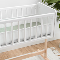 Close-up of bassinet railing and mattress