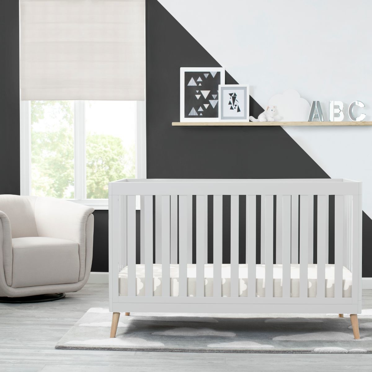 Delta Children Essex 4-in-1 Convertible Baby Crib - Bianca White With Natural Legs.