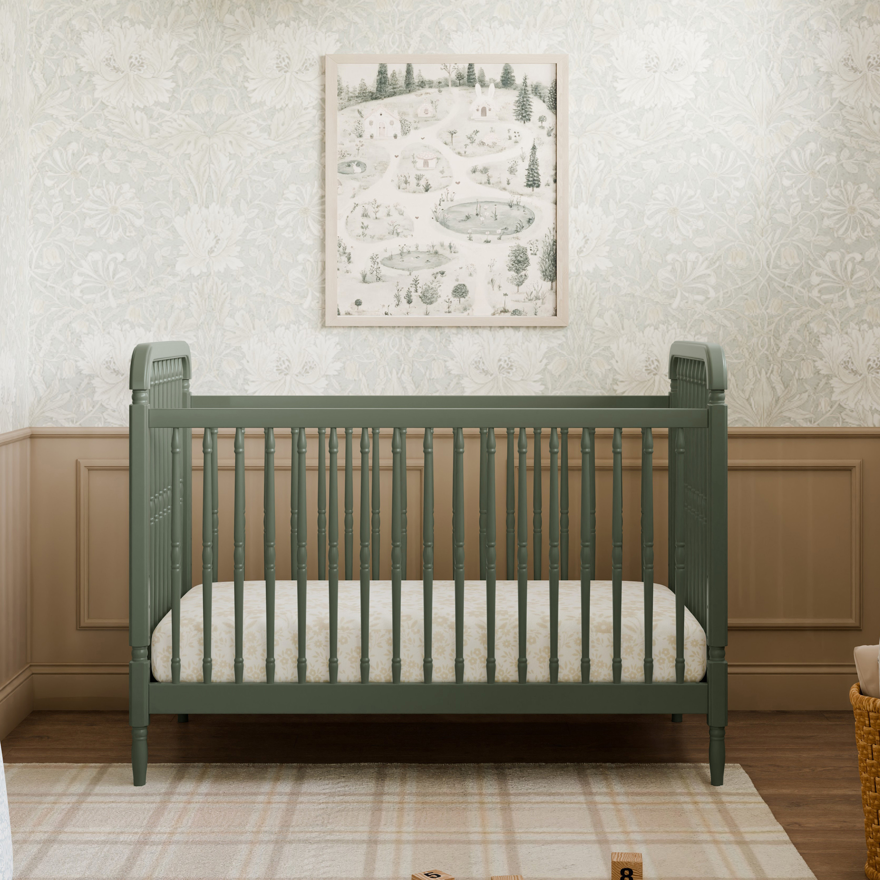 Dark green spindle crib in a nursery setting.
