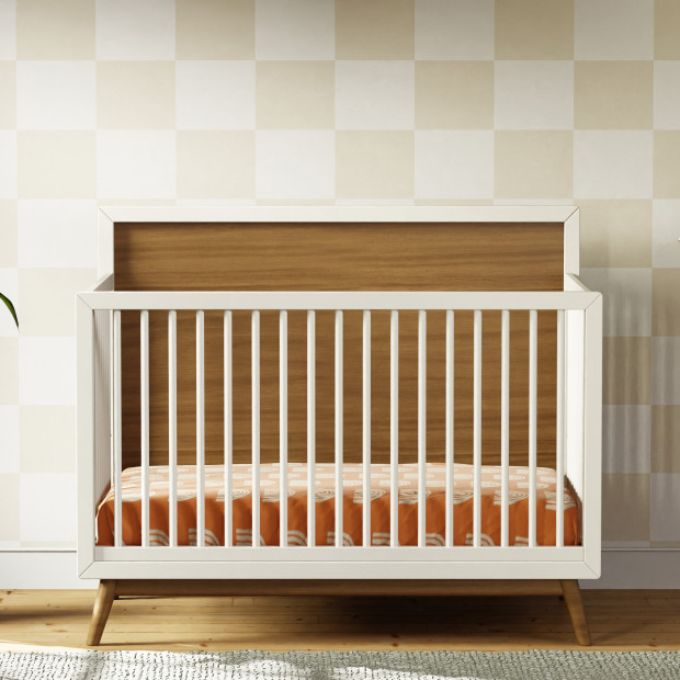 babyletto Palma 4-in-1 Convertible Crib with Toddler Bed Conversion Kit - Warm White With Natural Walnut.